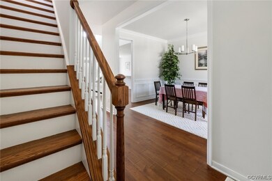 Spacious, hardwood foyer. Leads to formal dining r