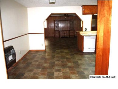view from den through the eat in kitchen and living room