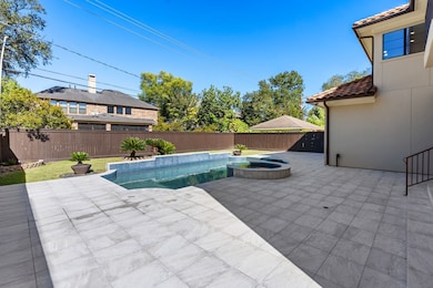 A generous backyard on a 9,450?sf lot, featuring a pool and spa, uncovered patio, play-friendly grassy area, and covered BBQ space.