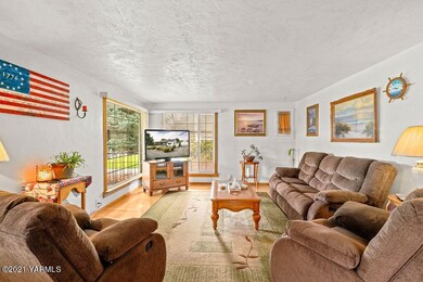 Formal living gleaming hard wood floors