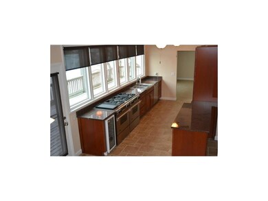 Jenn-air range, wine cooler, tile flooring, granit