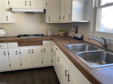 New counter top and new sink and new facet.
