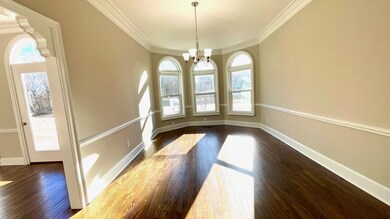 Unfurnished dining area featuring dark wood-style 