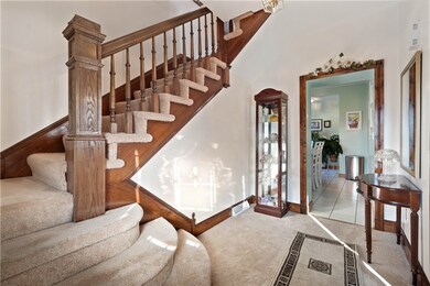 SPACIOUS FRON ENTRY LEADS TO THE DINING ROOM ON YO