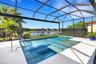 View of pool featuring a patio area, a lanai, an i
