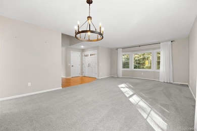 Living/dinging room with new carpet, paint & light fixtures