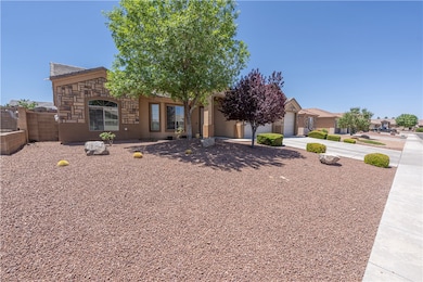 View of front facade with concrete driveway, an at