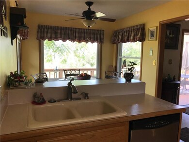 Yes, one can stand at this sink and allow the outs