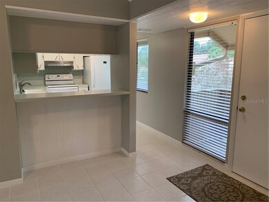 View of bar/kitchen from dining area.  Large windo