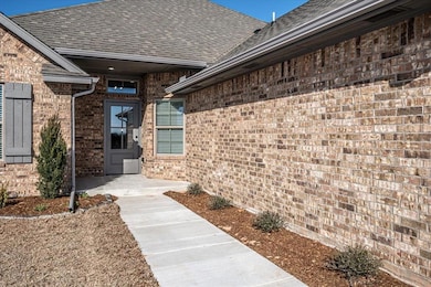 Doorway to property featuring a patio area