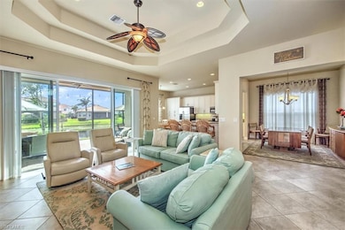 Tiled living room with a raised ceiling and ceilin