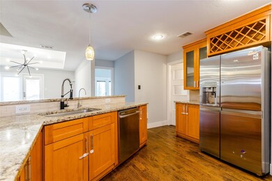 Large kitchen with lots of cabinets and counter sp