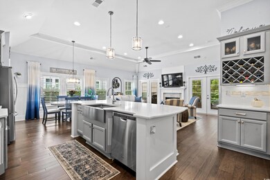 Kitchen featuring a wealth of natural light, sink,