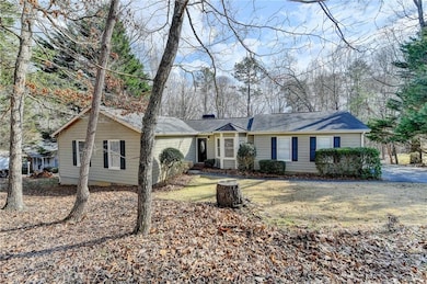 Ranch-style house featuring a chimney