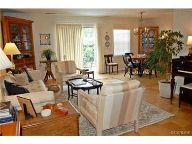 Open living room and dining room with a view of the sliding doors to the patio.