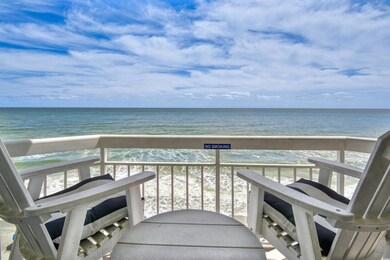 Balcony with a view of the beach and a water view