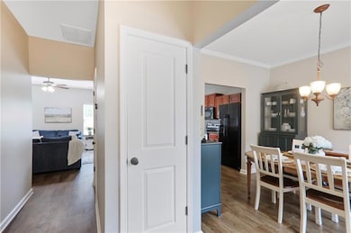 Step into a bright and welcoming foyer where warm 