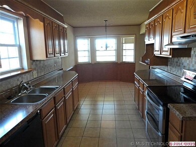 New counter top and tile back splash in kitchen