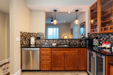 Stunning kitchen with rich wood cabinetry, double 