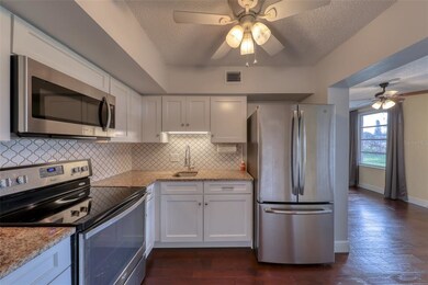 The kitchen has new cabinets, stainless steel appl
