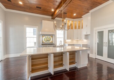 Kitchen measures 23x14 with lighted floor to ceili