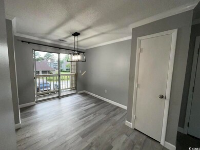Unfurnished dining area featuring wood-type floori
