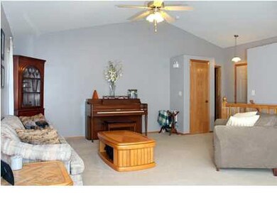 Living room has vaulted ceilings for an open spaci