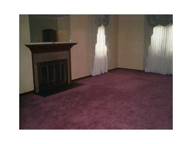 Living Room. Hardwood Floors Under Carpet with Doo