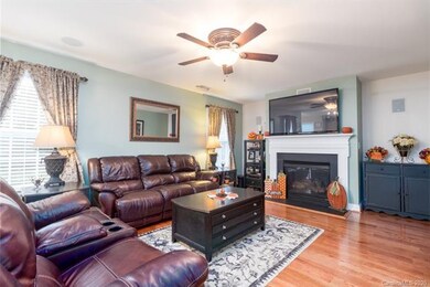 Cozy family room with gas log fireplace.