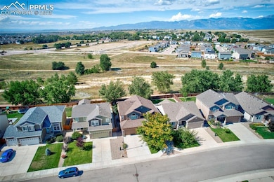Aerial view of residential area featuring a mountainous background