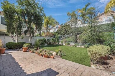 Large backyard features a stamped concrete patio, 