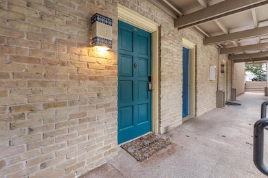 Doorway to property with brick siding