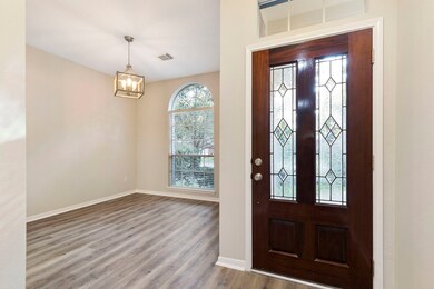 Located off of the entry is this great space that can be used as a study or dining room with updated lighting and luxury vinyl wood plank flooring.