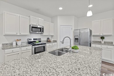 Featuring Stainless Steel Appliances and Large Cen