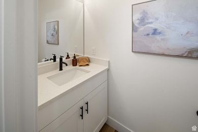 Bathroom with vanity and baseboards