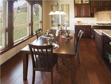 Family dining, wood floors, Low E windows, water w
