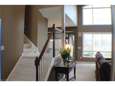 DOUBLE SIDED STAIRCASE PRESENTS AN OPEN FLOOR PLAN