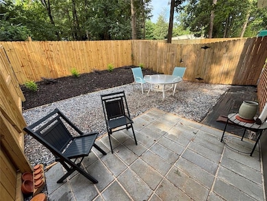 Fenced backyard featuring a patio