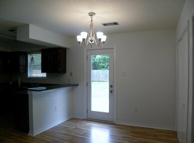   Delightful kitchen with stained cabinets, granit