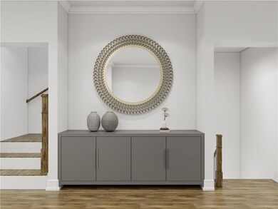 Detailed view of ornamental molding and wood finished floors