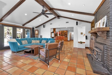 The spacious living room showcases a vaulted ceili