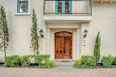 Beautiful architectural touches with cypress trees dotting the perimeter give the flavor of an old school villa on the Mediterranean.