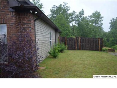 View of the right side of the house. Wooded privac
