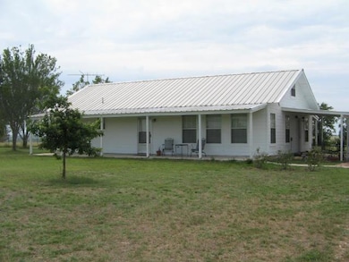 Farmhouse inspired home featuring covered porch, 