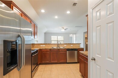 Kitchen featuring stainless steel appliances, a p