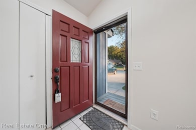 Entryway featuring light tile patterned flooring