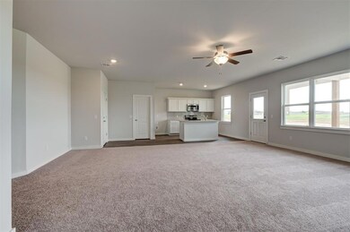 Unfurnished living room with a ceiling fan, carpet, baseboards, and recessed lighting