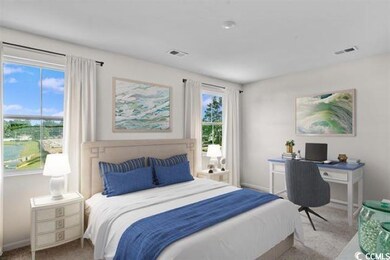 Bedroom with visible vents, baseboards, and carpet