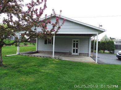 carport on side of 2 car garage