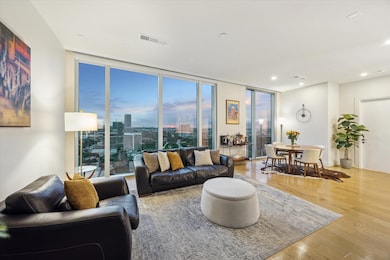 Sunset views and the open concept living and dining areas create a seamless flow. It is perfect for both intimate gatherings and entertainment.